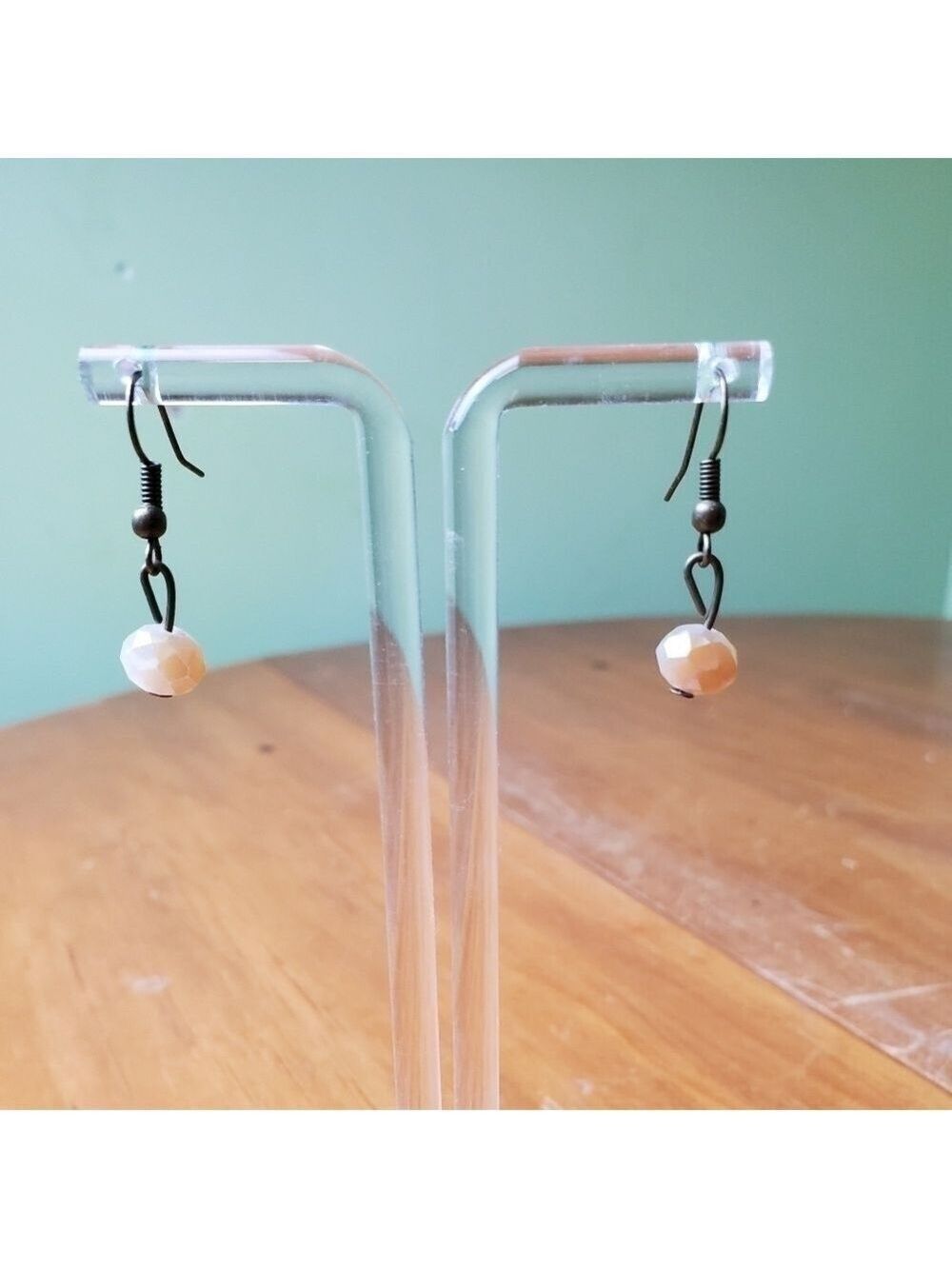 NWOT earrings, dangling, white/amber colored stone